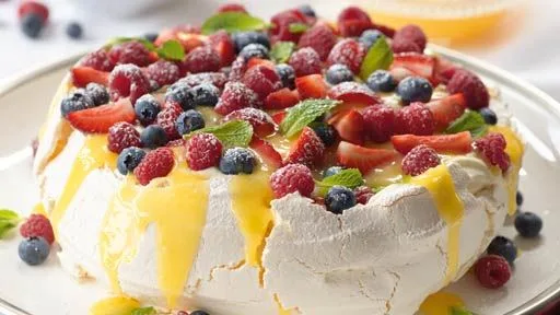 Lemon Butter Pavlova with Fresh Berries and Cream